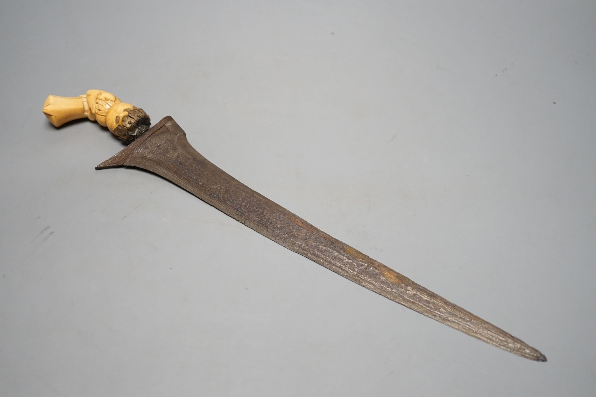 A 19th century ivory handled Kris, 40 cms long.